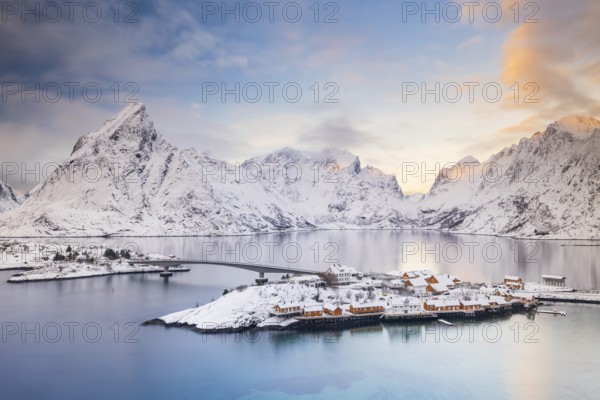 View of snow-covered islands, fjord and mountains, fishing village Sakrisøy, Reine, Reinefjord, Lofoten, Norway, Europe