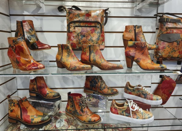 Shelf full of colourful shoes and handbags in a vibrant style, La Boca district, Buenos Aires, Argentina, South America