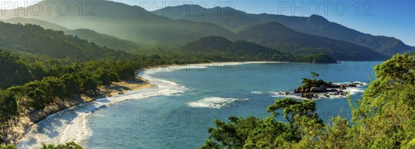 Panoramic image of Castelhanos beach between the sea, mountains and forests of the island of Ilhabela on the coast of Sao Paulo, Castelhanos beach, Ilhabela, Sao Paulo, Brazil, South America