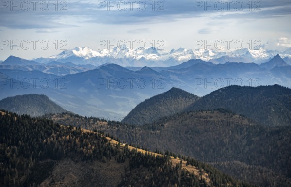 View of the Alpine foothills and main Alpine ridge with snow-covered peaks, summit of the Hohe Tauern with Großvenediger, from the Austrian Schinder, Bavarian Alps, Mangfall mountains, Bavaria, Germany, Europe