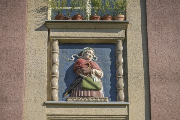 Midwife, relief on old building, former woman's and children's clinic, today St. Marien residential park, Mariendorfer Weg, Neukölln, Berlin, Germany, Europe