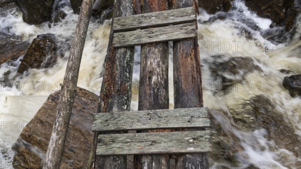Wooden bridge over a stream, near Kvam, Gudbrandsdalen, Norway, Europe