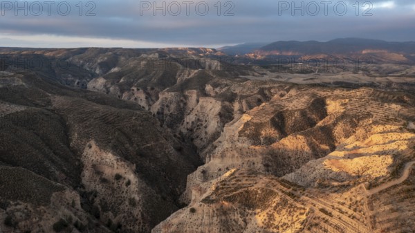 Sunrise, wide hilly desert landscape with dry vegetation, Gorafe desert, semi-desert, Granada, Andalusia, Spain, Europe