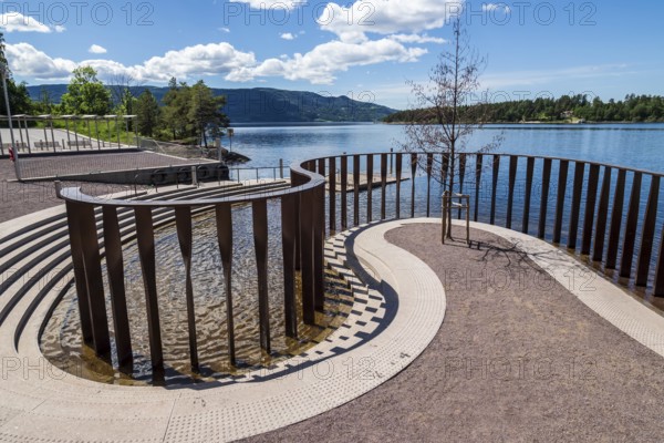 Memorial for the Utøya terror attack of 2011, metal pillars for every person killed, Utøyakaia at the Tyrifjord, Norway, Europe