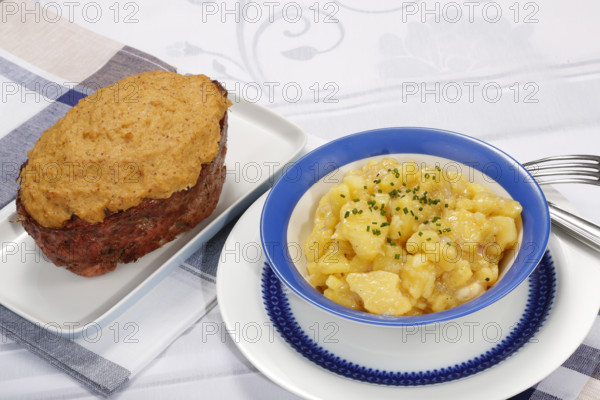 Swabian cuisine, Stuttgarter Leberkäs in a horseradish-mustard coating, Swabian potato salad, Leberkäse, meat loaf, mustard crust, grandmother's cooking, regional, home cooking, serving platter, cutlery, knife, fork, typical Swabian, traditional cuisine, food photography, studio, Germany, Europe
