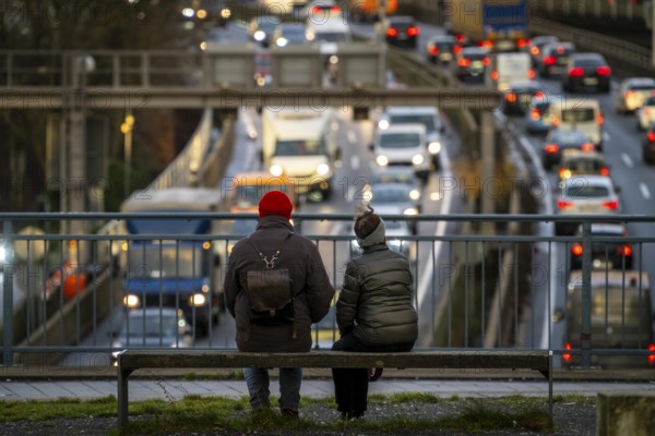 Traffic jam on the A40 motorway, city passage, Essen-Huttrop junction, traffic jam in both directions, 2 people looking at the traffic jam, at the Ruhrschnellweg tunnel, in the city centre, North Rhine-Westphalia, Germany, Europe