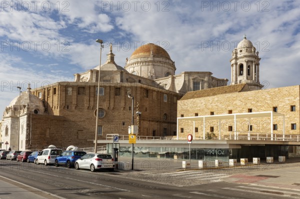 Historic building with dome and street with parked cars, Cadiz