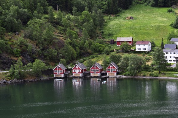 Red houses by the water in Flam, Norway, Europe