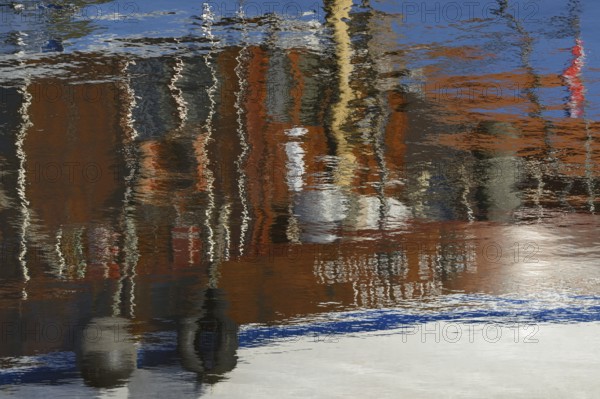 Reflection, colourful reflections on the water surface, maritime impressions, Greetsiel, North Sea, Lower Saxony, Germany, Europe
