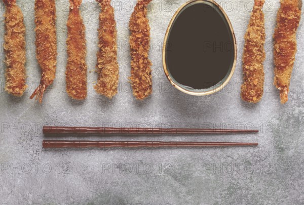 Fried tiger prawns in tempura, top view, soy sauce, chopsticks