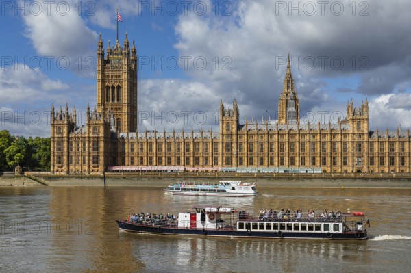 Excursion boats on the Thames at the Houses of Parliament, London, England, Great Britain