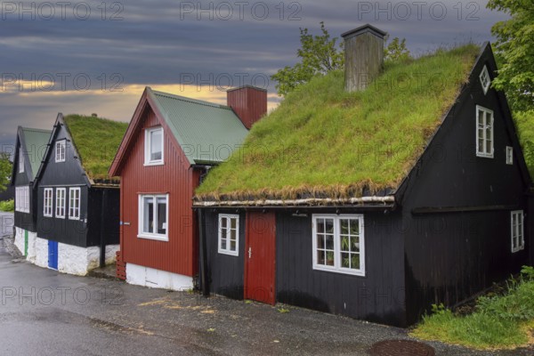 Traditional black tarred wooden houses with turf roofs at Reyn, Tinganes, old town of Tórshavn, capital city on the island Streymoy, Faroe Islands, Europe