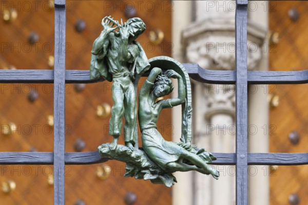 Prague castle, Gothic Metropolitan Cathedral of Saints Vitus, Wenceslas and Adalbert, Decorative figure of daily life scene on a fence, Prague, Czech Republic, Europe