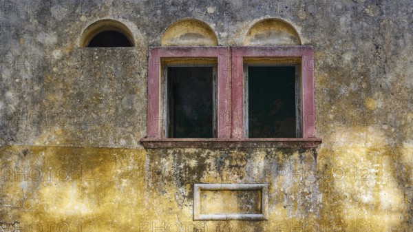 Two old windows in a dilapidated, yellow façade with heavily faded and peeling areas, Italian Governor's Palace, Ruins, Italian colonial settlement, Eleousa, Rhodes, Dodecanese, Greek Islands, Greece, Europe