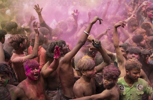 Revellers dancing in the beat of music as they celebrate Holi on a street, the Hindu spring festival of colours on March 25, 2024 in Guwahati, Assam, India. Holi, also known as the Festival of Colors or the Festival of Spring, is one of the most vibrant and joyous festivals in India