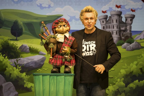 Sascha Grammel with hand puppet Frederic Freiherr von Furchensumpf live on Wünsch dir was Tour at the Tempodrom in Berlin on 12 October 2024
