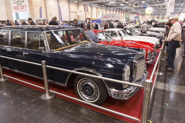 Visitors to Techno Classica take a look at a Mercedes Benz 600. Techno Classica is the trade fair for vintage, classic and prestige cars, motorsport, motorbikes, spare parts and restoration, Essen, 27 March 2014, Essen, North Rhine-Westphalia, Germany, Europe