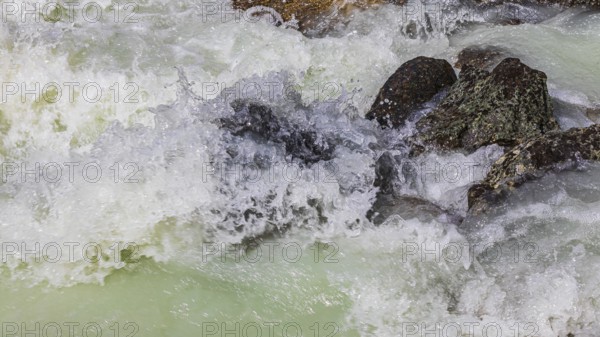 Dark boulders in a glacial stream, near Grimentz, Val d'Anniviers, Valais Alps, Canton Valais, Switzerland, Europe
