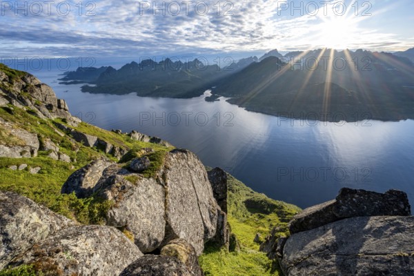 View of Fjord Raftsund and mountains in the evening light, sun star, view from the top of Dronningsvarden or Stortinden, Vesterålen, Norway, Europe