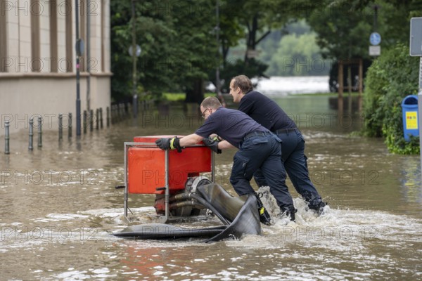 Flood on the Ruhr, after long heavy rainfall the river left its bed and flooded the countryside and villages, the highest water level ever recorded, the fire brigade pumps water out of the streets, Mülheim an der Ruhr, North Rhine-Westphalia, Germany, Europe