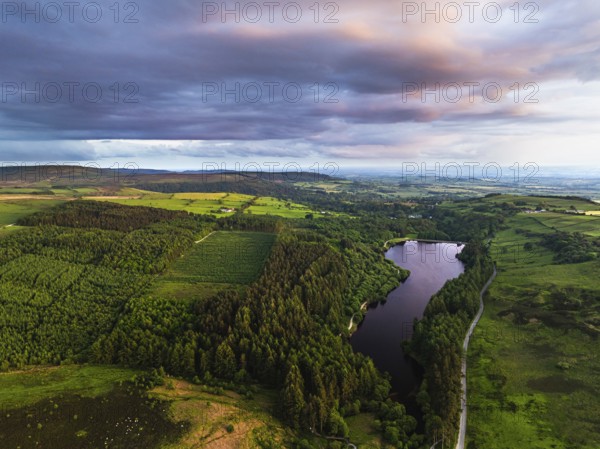 Sunset over Cod Beck Reservoir from a drone, North York Moors National Park, North Yorkshire, England, United Kingdom, Europe