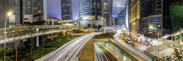 Traffic with streets and skyscrapers in the city of Hong Kong at night Panorama in Hong Kong, China, Asia