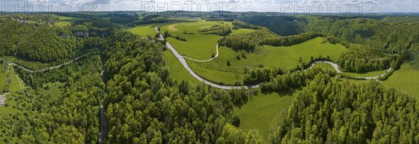 Winding country road through a forest, Swabian Alb in spring, panoramic photo, drone photo, Gutenberg, Lenningen, Baden-Württemberg, Germany, Europe