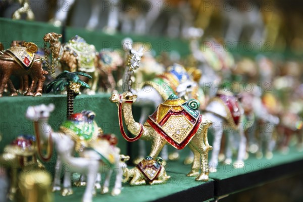 Souvenir camels in the souk or soug or market in the old town of Nizwa, ad-Dachiliyya region, Oman, Asia