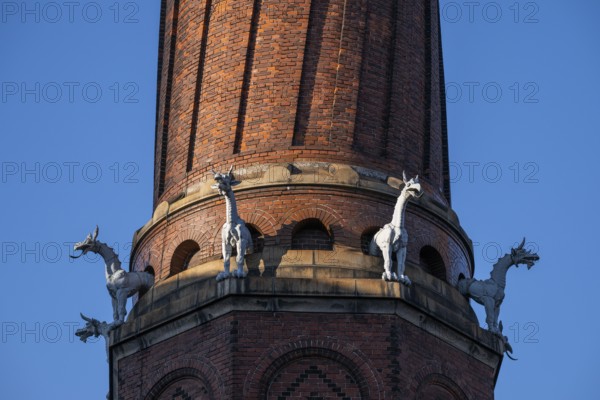 Detail, coiled industrial chimney by Carl Jacobsen, Vilhelm Dahlerup and PS Beckmann with replicas of the chimeras or gargoyle sculptures from Notre-Dame, Carlsberg district, Copenhagen, Denmark, Europe