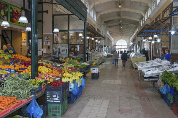 A market hall with various colourful fruit and vegetable stalls and people shopping, Xanthi, Eastern Macedonia and Thrace, Greece, Europe