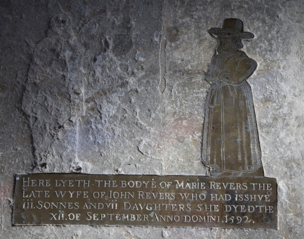 Brass figure of sixteenth century woman who had ten children, All Saints and St Margaret's church, Chattisham, Suffolk, England, UK