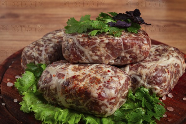 Raw apkhazura, a dish of Georgian cuisine, meat balls, minced meat wrapped in a fat net, seftalia, homemade, no people