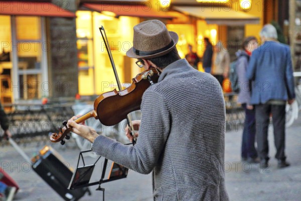 Florence, Italy-June 16, 2017: Street musicians entertaining tourists near landmark Florence attraction