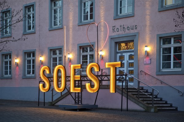 Illuminated town hall in the early evening at the Winterstrahlen Festival of Lights in Soest, North Rhine-Westphalia, Germany, Europe