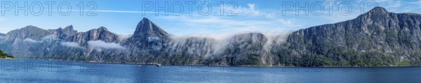 Panorama of fjord Mefjord with famous peaks Hesten, Segla and Grytetippen, salmon farm, Senja island, Norway, Europe
