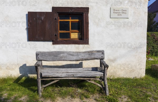 Wooden bench in front of the Stenz poorhouse from 1826, today a pilgrims' hostel on the Via Regia, Königsbrück, Saxony, Germany, Europe