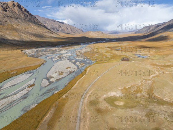Aerial view, Burkhan mountain valley with meandering river, barren dramatic mountain landscape, Terskey Ala-Too, Tien Shan, Issyk Kul province, Kyrgyzstan, Asia