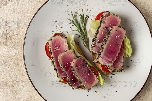 Sandwiches with fried tuna fillet, sesame, breakfast, top view, homemade