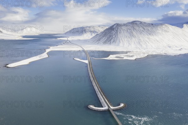 Aerial view over Sword bridge in winter, road bridge over Kolgrafafjörður in the north of the Snæfellsnes peninsula, western Iceland