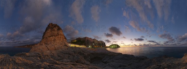 360° panorama at the beach Lido Le Roccette Club Tropea with the old town of Tropea situated on rocks of sandstone and the medieval church Santuario di Santa Maria dell Isola at sunset and bizarre cloudy sky, Tropea, Vibo Valentia, Calabria, Southern Italy, Italy, Europe