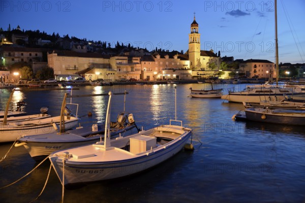 Fishing boats in the harbour of Sutivan front of the Sveti Ivan Church, Sutivan, Island Brac, Dalmatia, Croatia, Europe