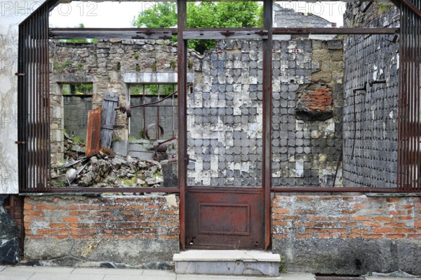 Burnt-out butcher's shop. The burnt village of Oradour-sur-Glane was destroyed on 10 June 1944 when 642 of its inhabitants, including woman and children, were massacred by a German Waffen SS company, Limousin, France, Europe