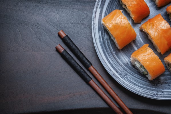 Philadelphia Sushi On Black Wood background
