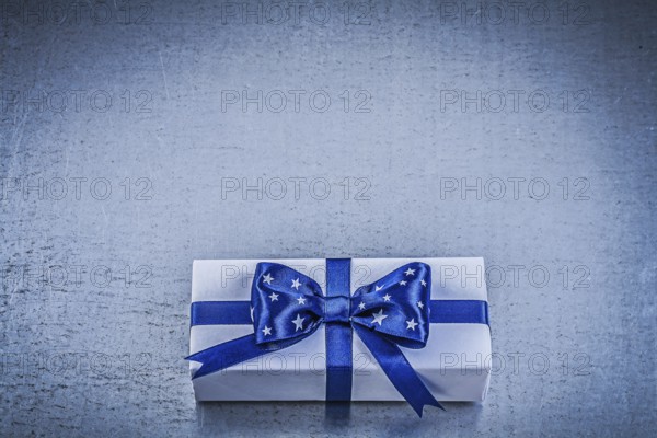 Packed box-container on metallic background celebrations concept