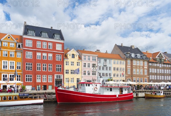 COPENHAGEN, DENMARK, JULY 31, 2016: Summer view of the famous Nyhavn with its colorful buildings
