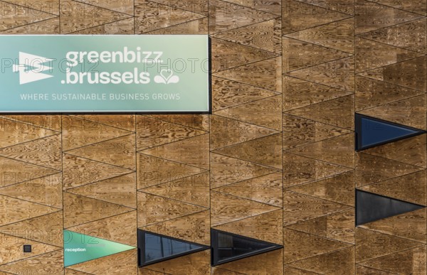 Belgium, 02 25 2019: Wooden brick wall with triangle pattern of the Greenbizz Brussels company, Europe