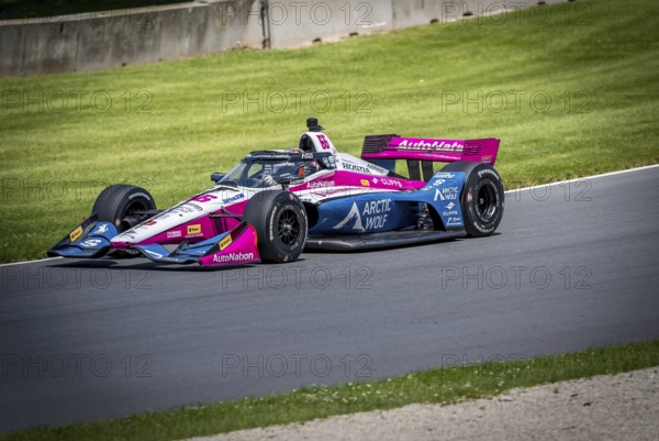 HELIO CASTRONEVES (66) of Sao Paulo, Brazil practices for the XPEL Grand Prix at Road America in Elkhart Lake, WI