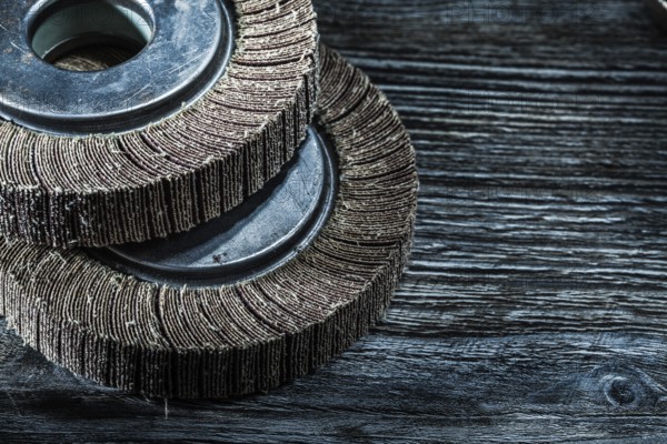 Used grinding discs on vintage wooden board