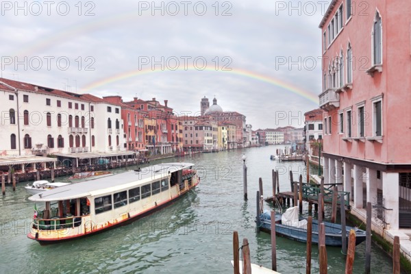 Grand channel in Venice with sailing motor boats and building exteriors