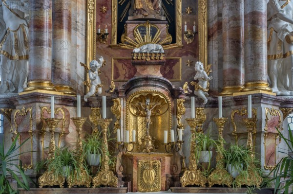 Main altar with candles and tabernacle, St George and Florian is a listed Catholic parish church in Reicholzried, Allgäu, Bavaria, Germany, Europe